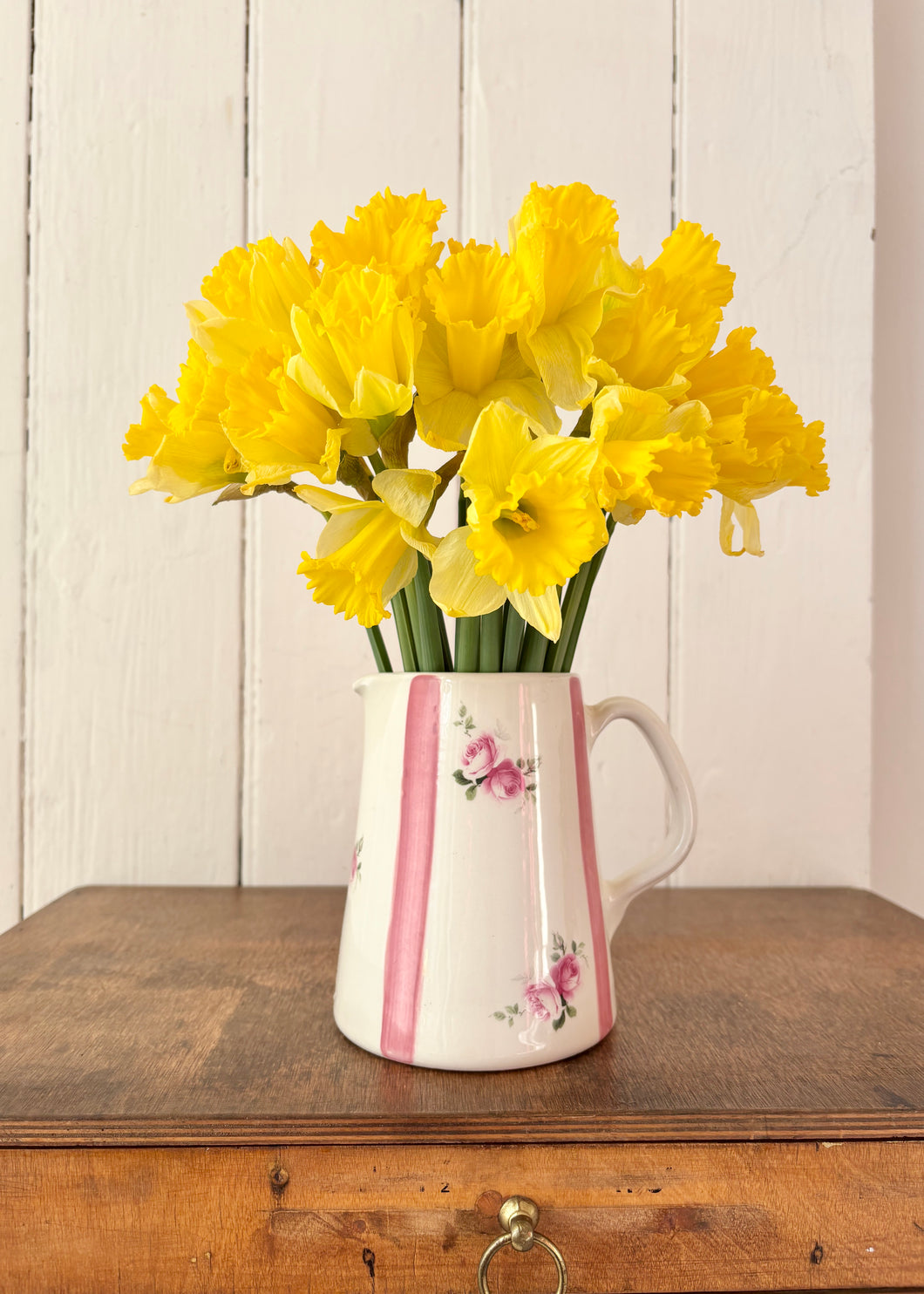 White jug with pink stripes and roses