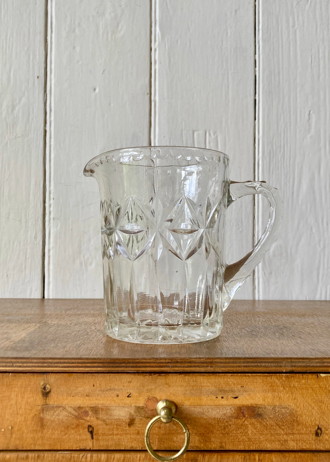 Clear pressed glass star design water jug