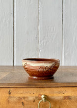 Load image into Gallery viewer, Studio pottery brown bowl with leaf decoration and slip glaze
