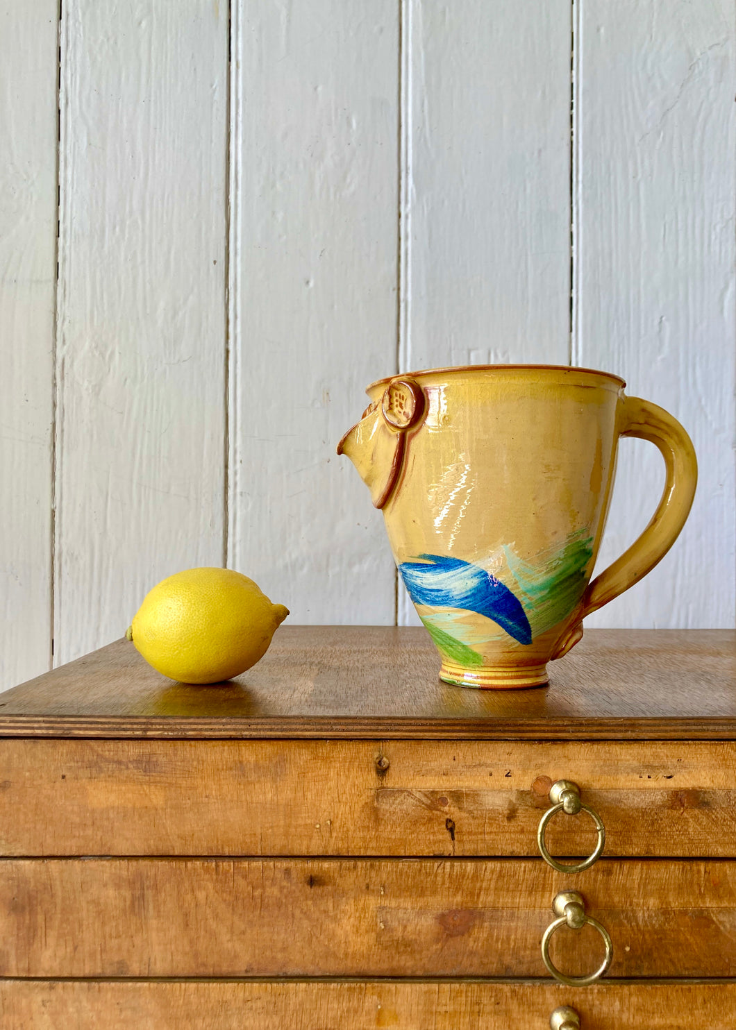 A sunshine yellow studio pottery, French jug