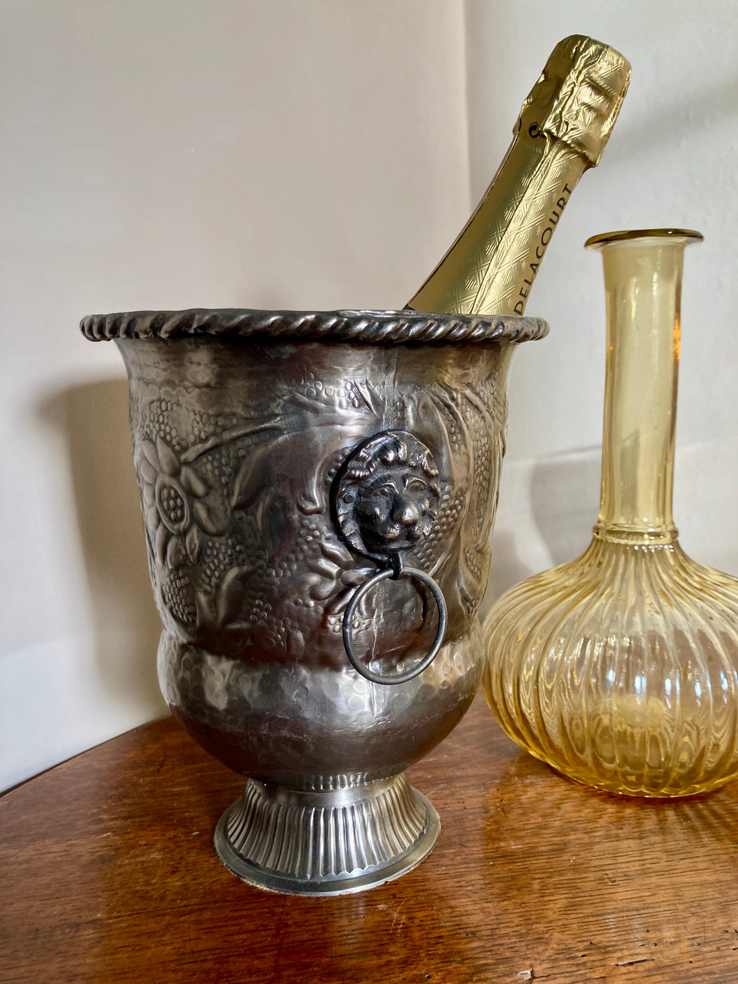 A pewter footed champagne or wine cooler in Arts & Crafts style